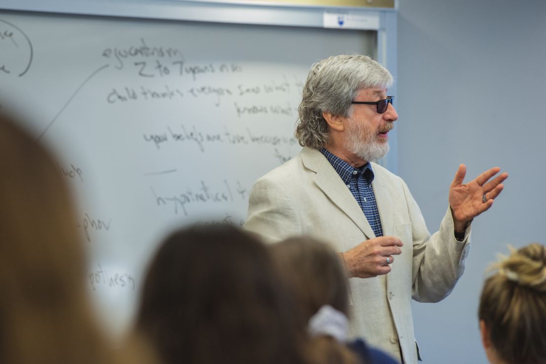 Professor at Penn State New Kensington teaches in front of a class.