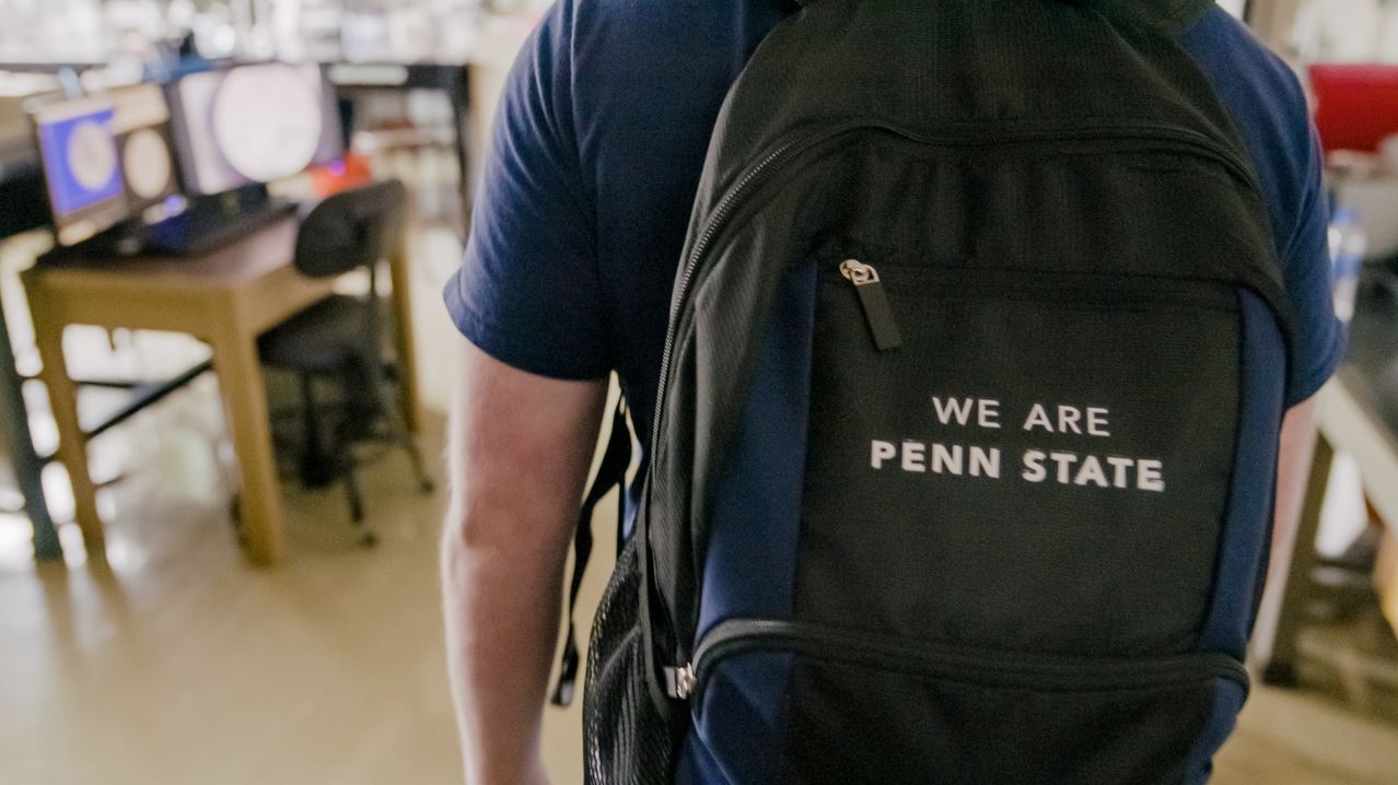 Student wearing a "We Are Penn State" backpack at Penn State Greater Allegheny.